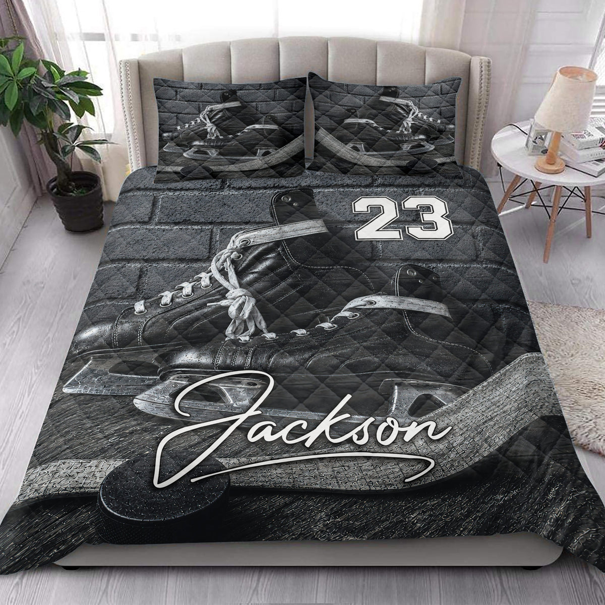 Ice hockey quilt bedding styled in a bright bedroom with dramatic skate and puck artwork
