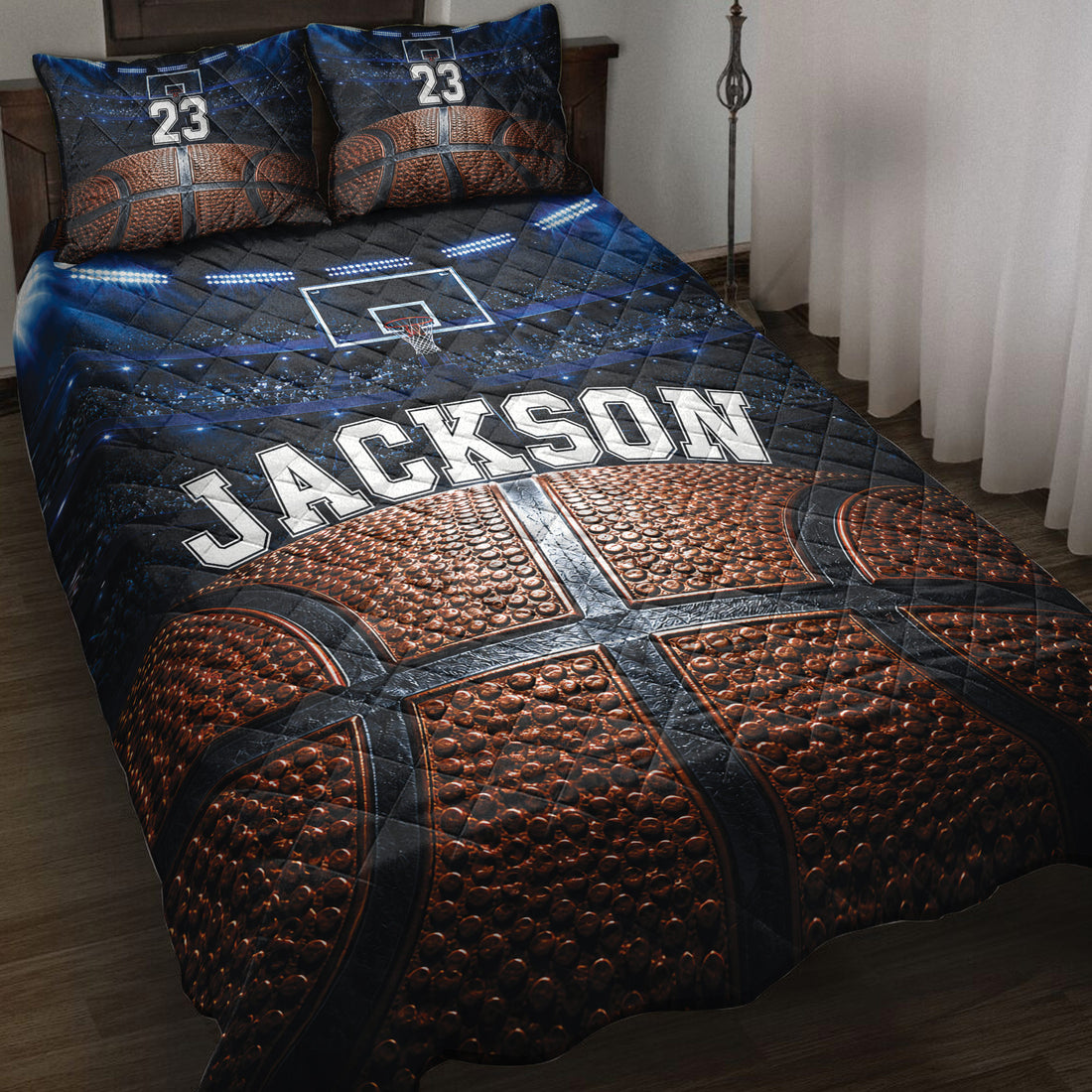 Basketball quilt bedding set displayed on a bed with arena lights, basketball artwork, and dark blue sports styling