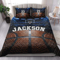 Basketball quilt blanket styled across a bedroom with basketball court artwork and vivid blue and orange colors
