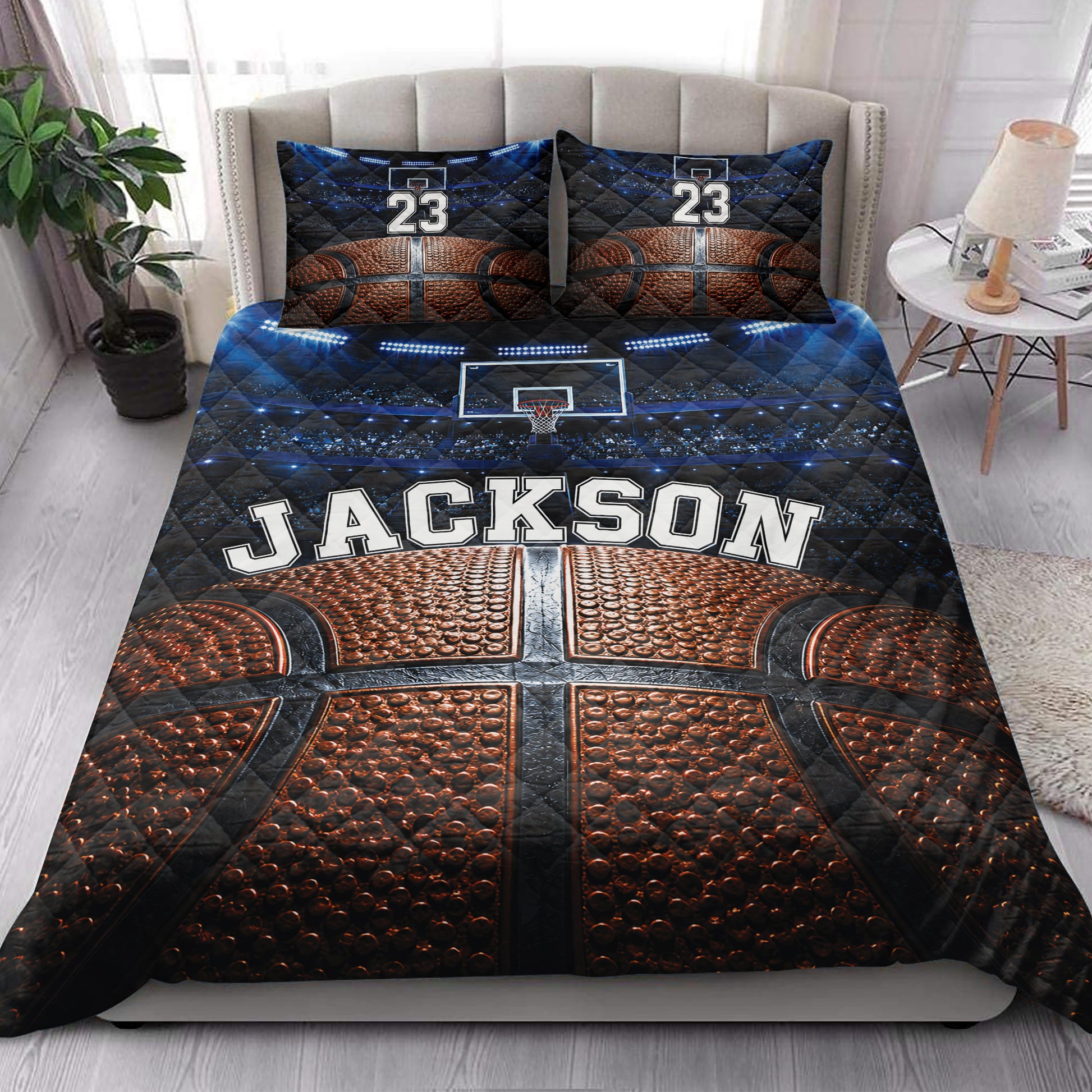 Basketball quilt blanket styled across a bedroom with basketball court artwork and vivid blue and orange colors