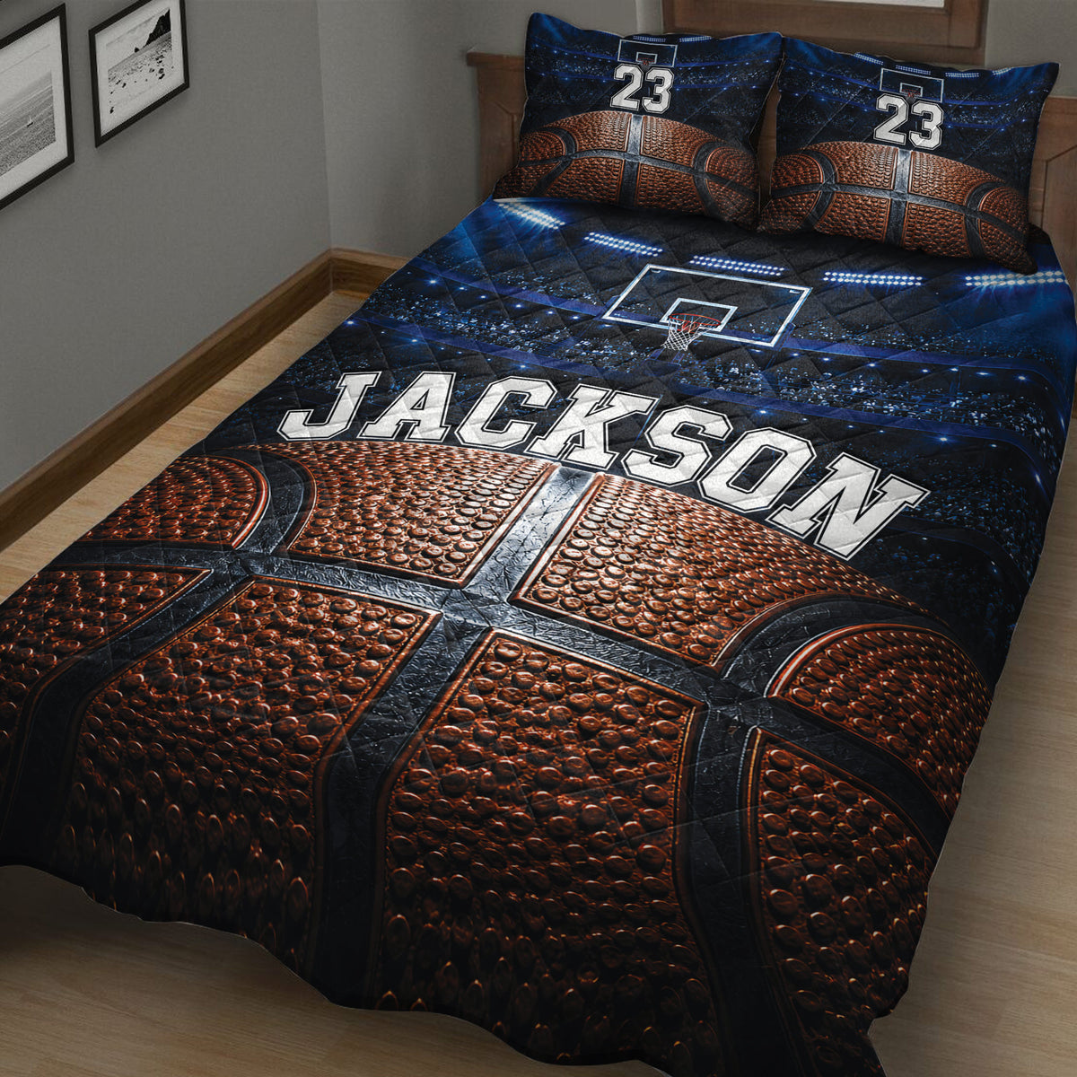 Angled bedroom view of a basketball quilt blanket featuring basketball texture, hoop artwork, and arena lighting