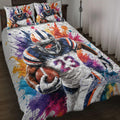 Football quilt bedding set displayed on a bed with colorful paint splatter artwork and player illustrations