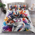 Football quilt bedding set styled in a modern bedroom with bold player artwork and colorful splatter details