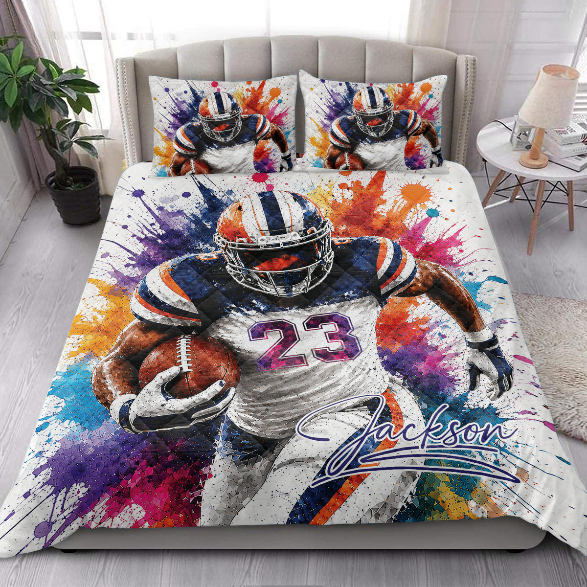 Football quilt bedding set styled in a modern bedroom with bold player artwork and colorful splatter details
