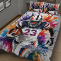 Close view of football quilt bedding with player illustration, football artwork, and vivid paint splashes