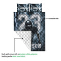 Football quilt showing the printed front artwork and white quilted backing in a product construction view