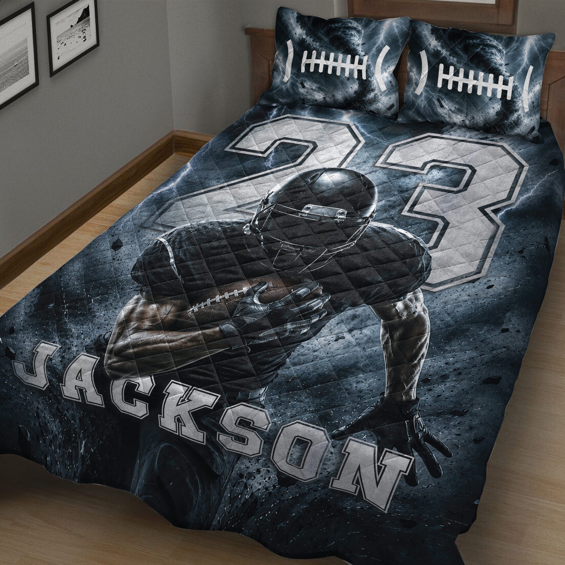 Close bedroom view of a football quilt featuring a helmeted player, football graphics, storm clouds, and dark blue artwork