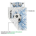 Soccer quilt showing the printed blue goal-net side and white quilted reverse backing