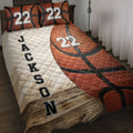 Basketball quilt blanket displayed on a bed with textured orange basketball artwork and bold sports styling