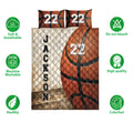 Basketball quilt bedding set shown with orange basketball artwork and a white quilted reverse