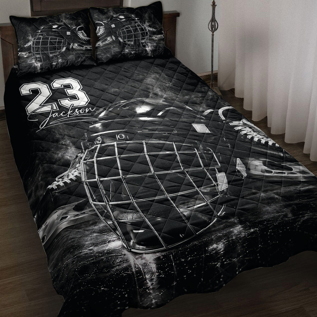 Black hockey quilt blanket displayed on a bed with goalie mask, skates, and bold sports artwork