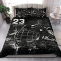 Black hockey quilt blanket styled in a modern bedroom with dramatic goalie mask artwork