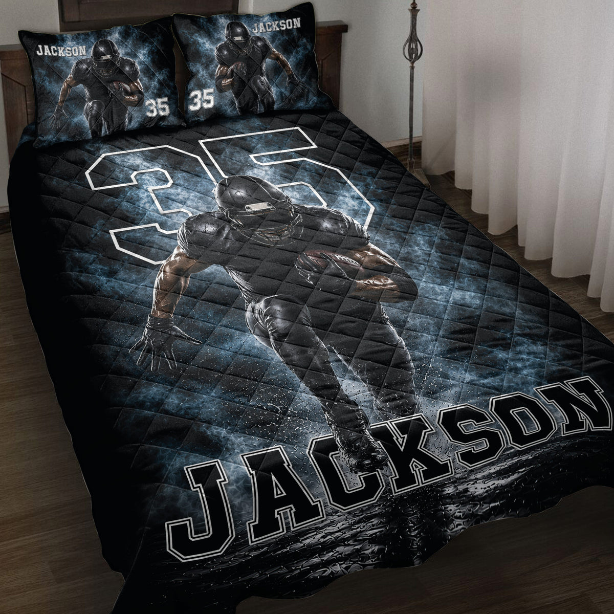 Black and blue football quilt blanket displayed on a bed with a running football player design