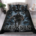 Football quilt styled across a bedroom with dramatic player artwork in black and blue
