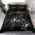 Wrestling quilt bedding set styled in a bedroom with bold black grappling artwork