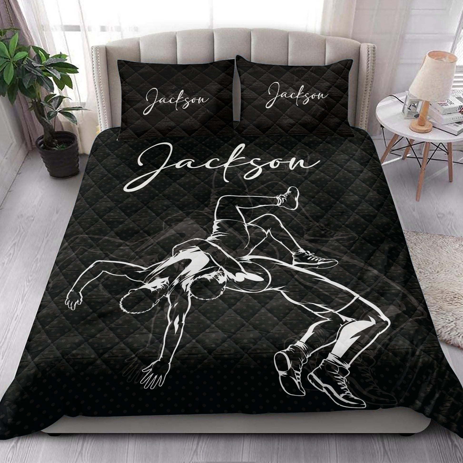 Wrestling quilt bedding set styled in a bedroom with bold black grappling artwork