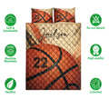 Basketball quilt bedding set shown front-facing with vivid orange artwork and bedroom styling