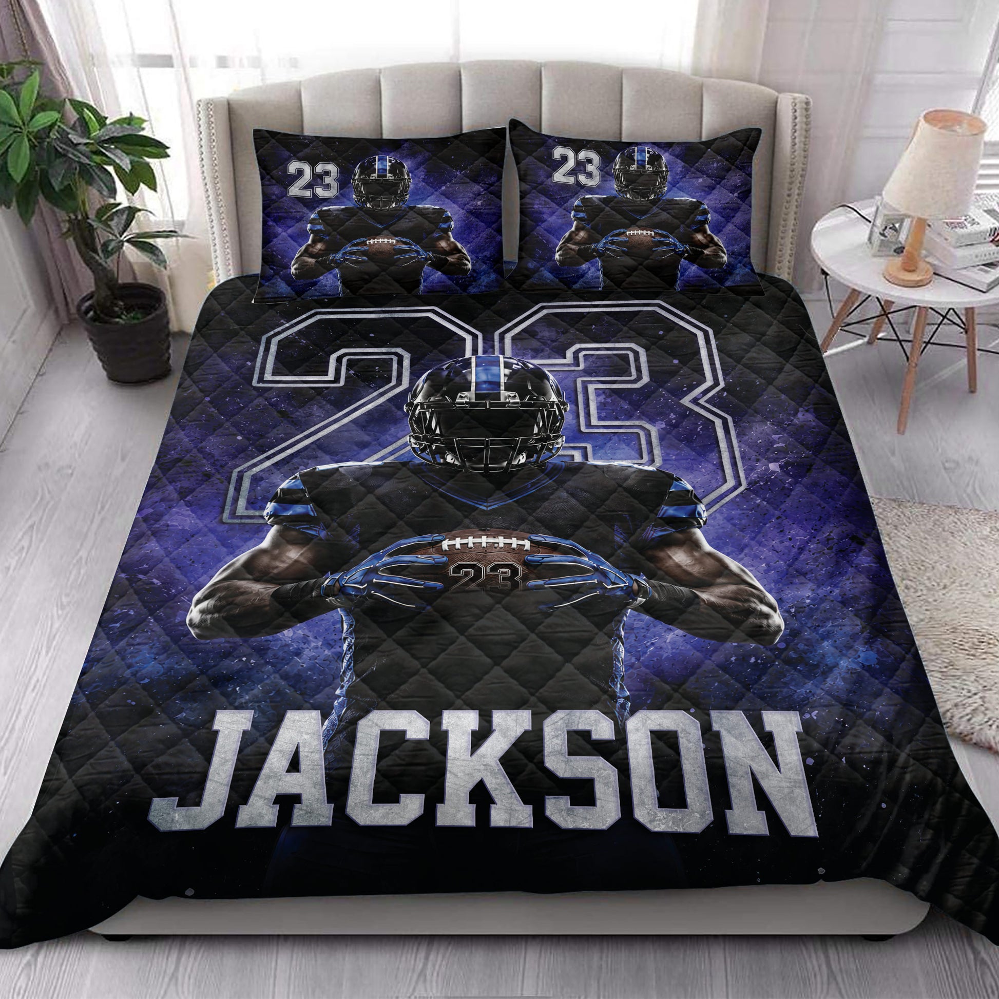 Football quilt bedding set styled in a bedroom with bold blue and black sports artwork