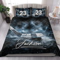 Hockey quilt blanket styled in a bedroom with dark blue ice artwork, rink graphics, stick, and puck