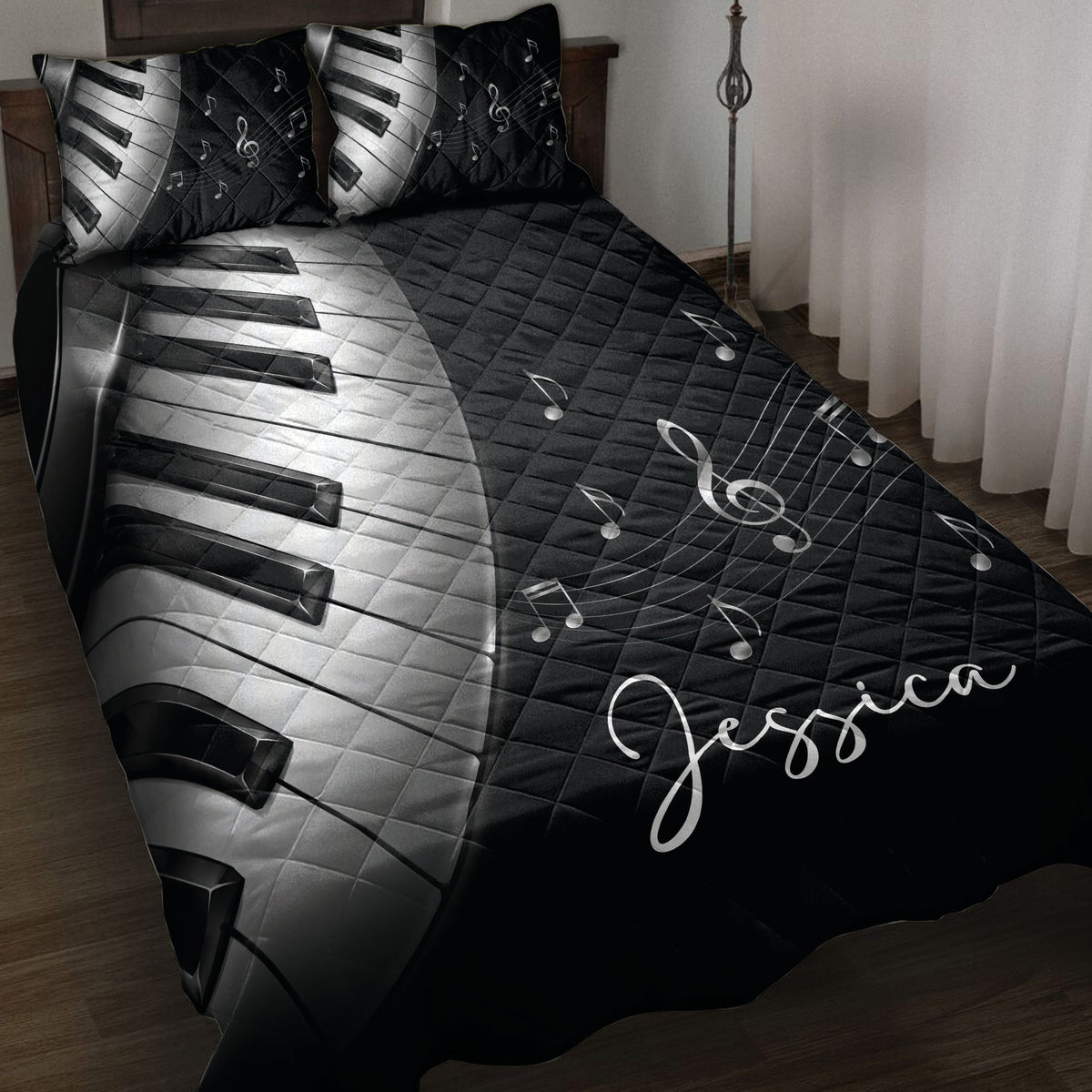 Black and white piano keys quilt blanket with musical notes and treble clef artwork on a bed