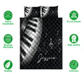 Piano quilt bedding set displayed with black and white keys, music notes, and product feature icons