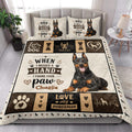 Doberman quilt bedding styled in a bright bedroom with a large seated dog portrait and paw print border