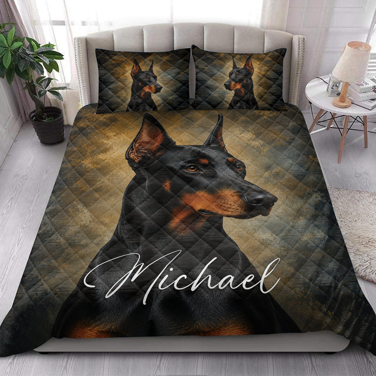 Doberman quilt blanket displayed on a modern bed with a large portrait and coordinating dog artwork