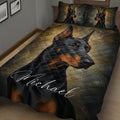 Close bedroom view of a Doberman quilt blanket with black and bronze portrait artwork