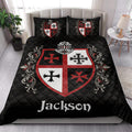 Knights Templar quilt bedding styled on a modern bed with matching heraldic shield artwork