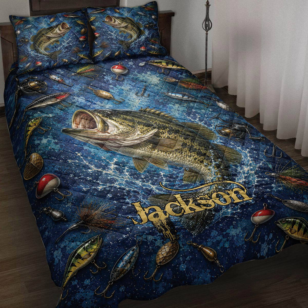 Fishing quilt blanket displayed on a bed with bass, fishing lures, reels, and deep blue water artwork