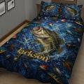 Close bedroom view of a bass fishing quilt blanket with lures, reels, hooks, and aquatic artwork