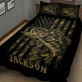 Close bedroom view of a black bass fishing quilt with camouflage stripes, star pattern, and large fish illustration