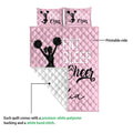Pink cheerleading quilt showing the printed front and white quilted reverse side