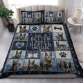 Australian Cattle Dog quilt bedding styled in a bright bedroom with matching dog artwork and paw prints