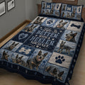 Close view of Australian Cattle Dog quilt blanket with blue panels, hearts, bones, and paw print artwork
