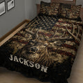 Close bedroom view of a deer quilt blanket featuring a detailed buck portrait, antlers, stars, and earthy tones
