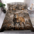 Deer quilt bedding styled in a bright bedroom with matching buck artwork