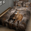 Rustic deer quilt blanket displayed across a bed with detailed buck and woodland artwork