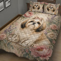 Shih Tzu quilt blanket displayed on a bed with roses, wildflowers, and detailed dog artwork
