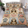 Shih Tzu quilt blanket styled on a bright bedroom bed with floral, heart, paw, and crown artwork