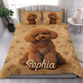 Poodle quilt bedding styled in a bright bedroom with a large dog portrait and matching pillows