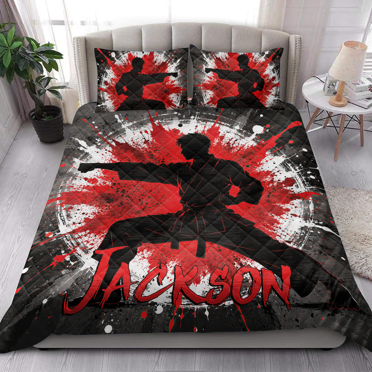 Karate quilt bedding styled in a bright bedroom with martial artist artwork across the bed and pillows