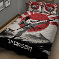 Close bedroom view of a karate quilt blanket featuring a martial artist, red sun, mountain landscape, and torii gate