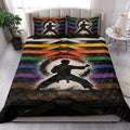 Karate quilt blanket styled in a bedroom with martial artist artwork and colorful belt-inspired stripes