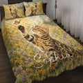 Bengal cat quilt blanket spread across a bed with butterflies and wildflower meadow artwork