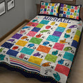 Close view of a colorful sign language quilt blanket covered with illustrated hand signs and alphabet letters