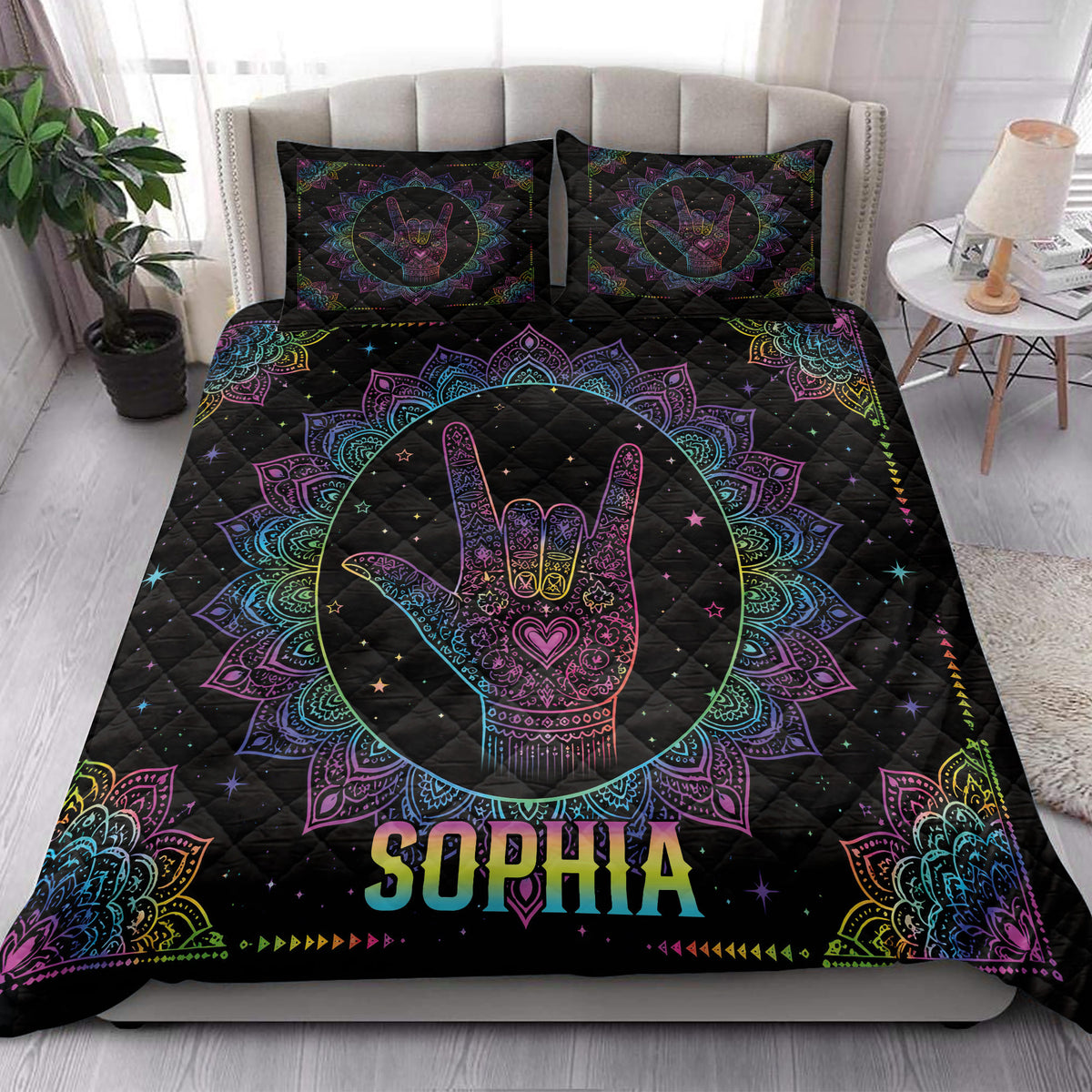 Sign language quilt blanket styled on a bed with colorful mandala hand artwork and bedroom decor