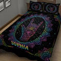 Close bedroom view of a black sign language quilt with rainbow mandala artwork and hand symbol