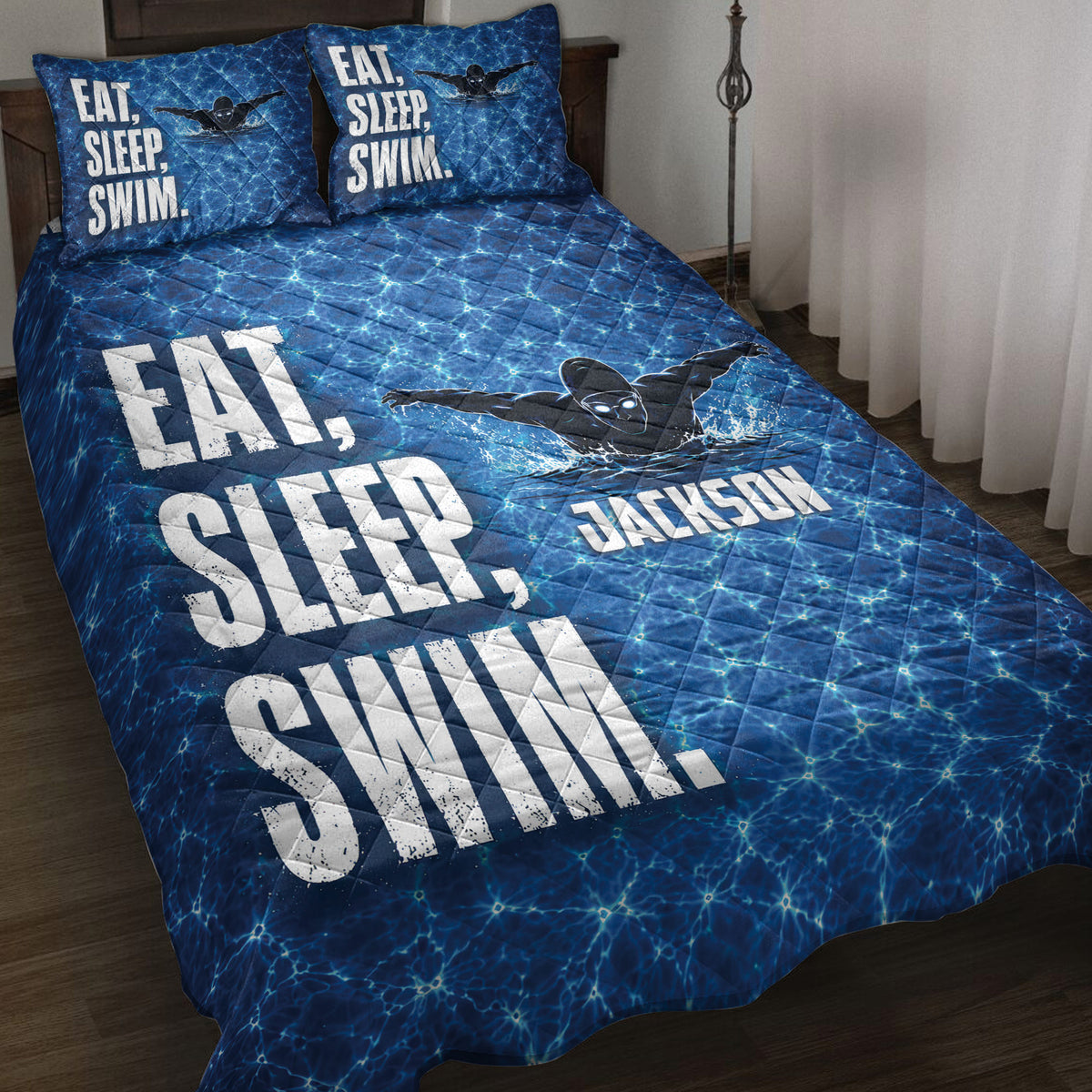 Blue swimming quilt bedding set with pool-water pattern and swimmer artwork in a bedroom