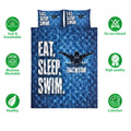 Swimming quilt blanket displayed with swimmer artwork, pool-water design and product feature icons